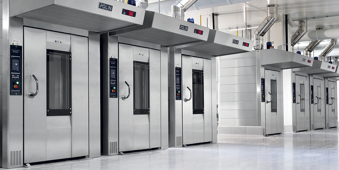 Line of industrial Polin RotoAvant commercial rack ovens in a modern bakery production facility