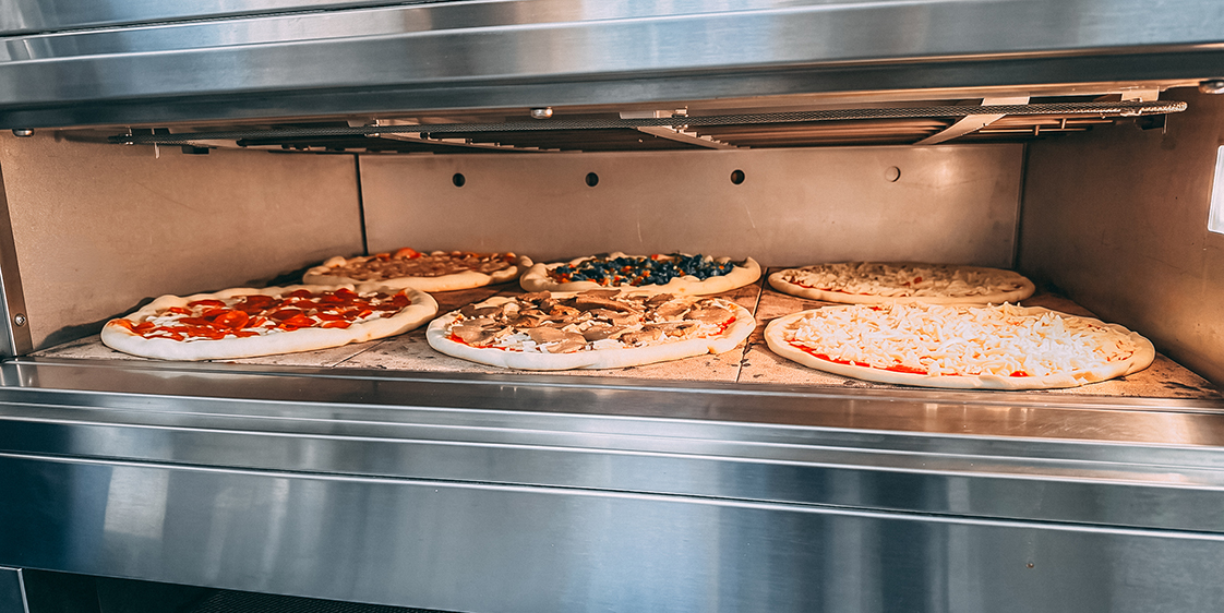 Polin Stratos XP Pizza electric deck oven baking several pizzas during service